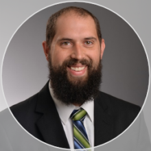 Professional headshot of Stuart F. Page