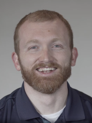 Headshot of Adam Carlson